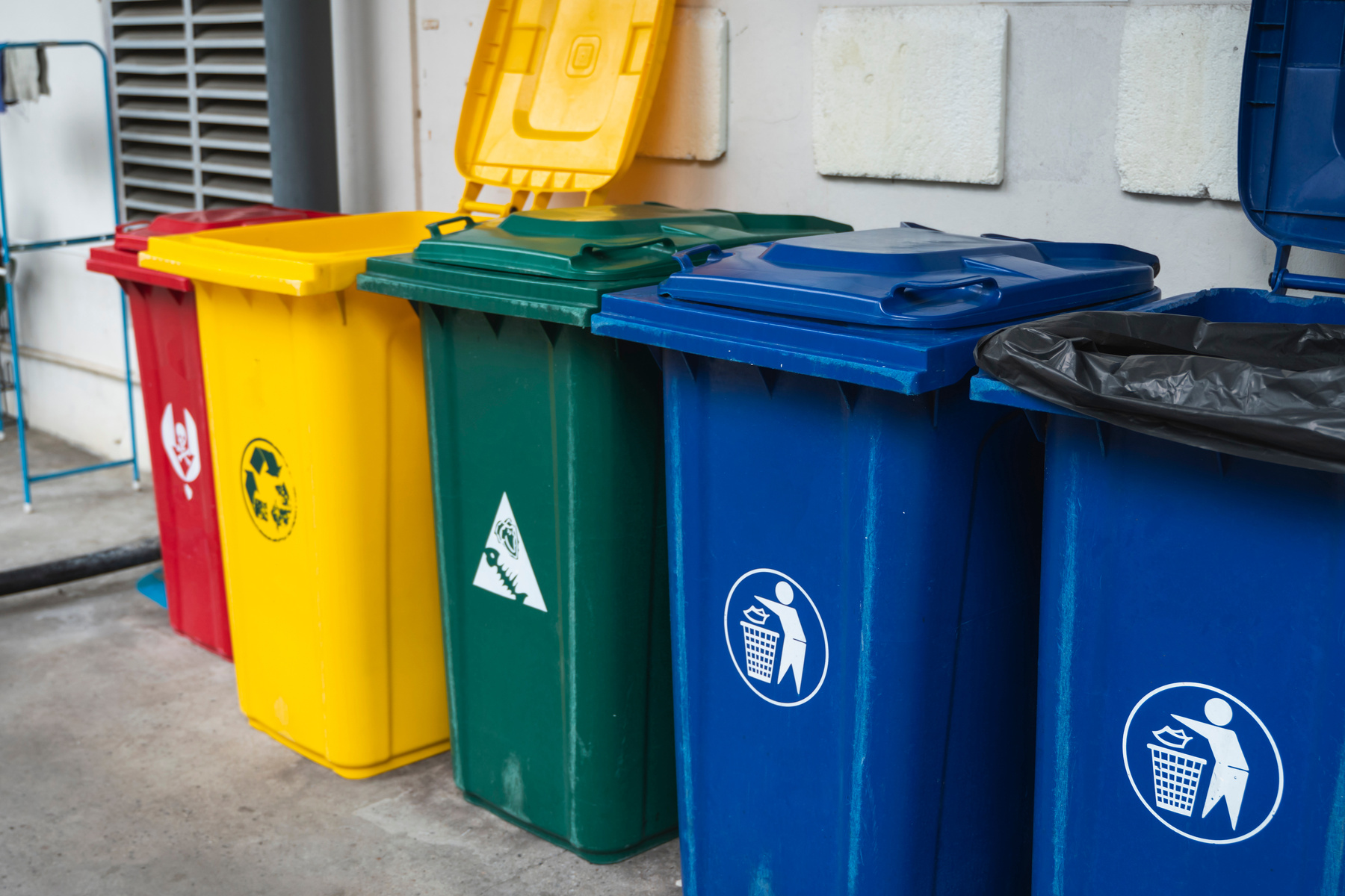 Garbage Trash Bins for collecting a recycle materials. Garbage trash bins for waste segregation. Separate waste collection food waste, plastic, paper and danger waste. Recycling. Environment.